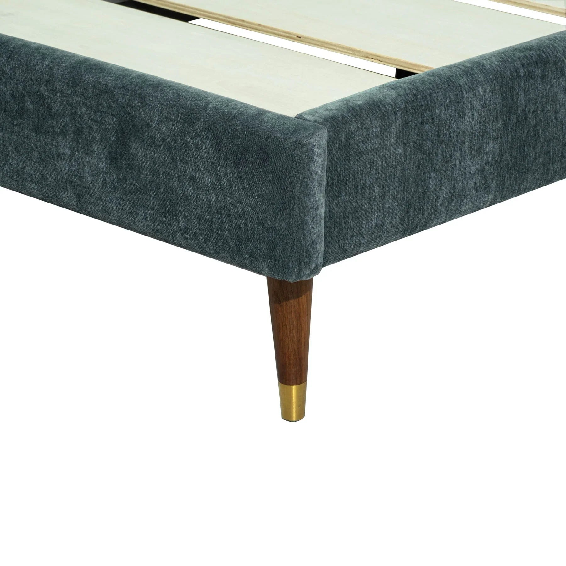 Detailed view of the mid-century inspired tapered leg featuring a decorative gold metallic tip and dark wood finish