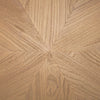 Direct overhead view highlighting the elegant sunburst wood veneer pattern on the circular tabletop surface