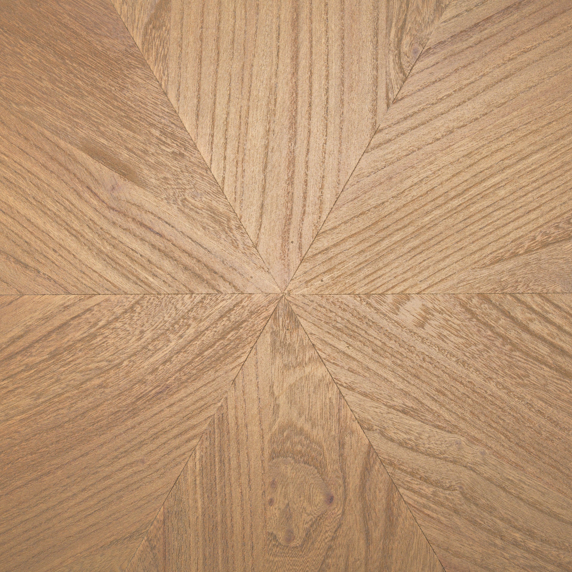 Front view of the Tavi round coffee table in a medium brown oak finish featuring a chunky double-cylinder pedestal base
