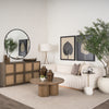 Lifestyle shot of the Tavi coffee table styled in a contemporary living room with a white sofa and natural wood accents