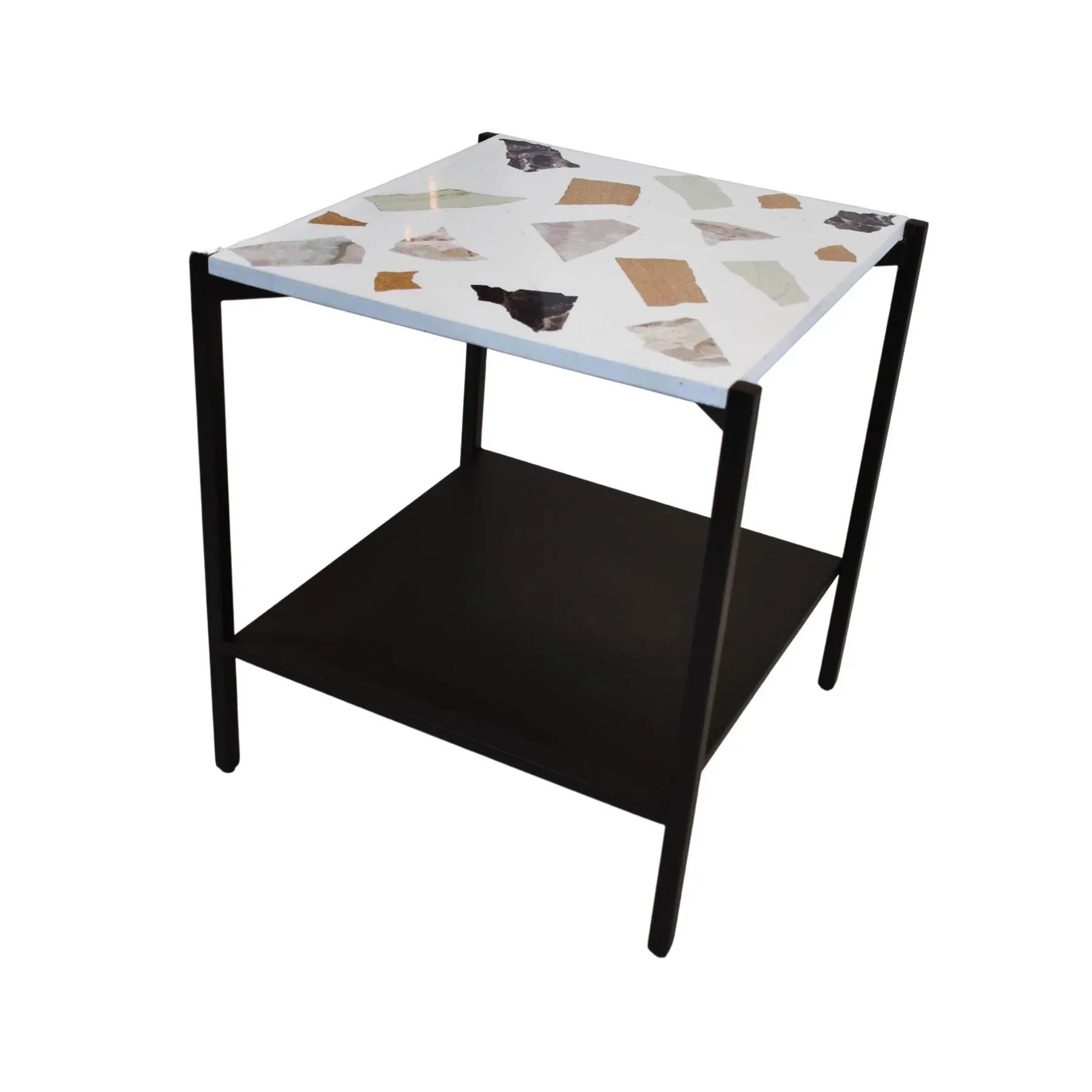 Three-quarter view of a square side table featuring a white mosaic terrazzo top and a black metal frame with a lower storage shelf