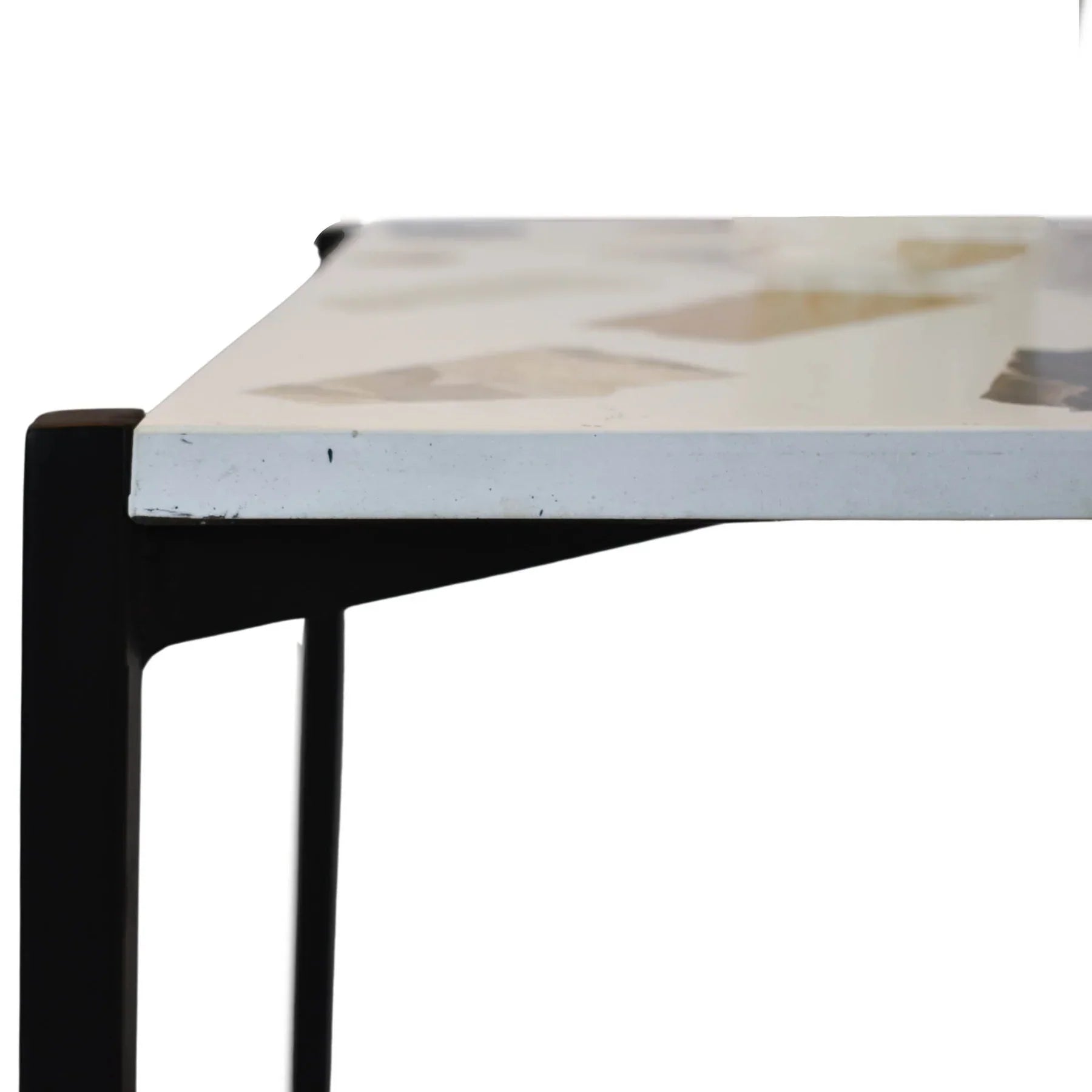 Three-quarter view of a square side table featuring a white mosaic terrazzo top and a black metal frame with a lower storage shelf