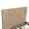 Perspective detail of the tall headboard highlighting the tactile surface and high-quality wood joinery
