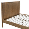 Perspective detail of the tall headboard highlighting the high-quality wood joinery and weathered finish