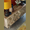 High-angle lifestyle detail highlighting the surface texture and gold handles styled with minimalist ceramic decor