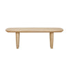 Front view of the Tonic coffee table in biscotti oak featuring a thick rectangular top and two wide block pedestal legs