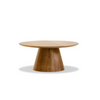 Front view of the Tower coffee table featuring a circular walnut tabletop with a thin beveled edge and a thick tapered pedestal base