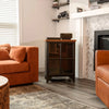 Wide lifestyle view demonstrating the table's scale and aesthetic appeal within a cozy contemporary interior