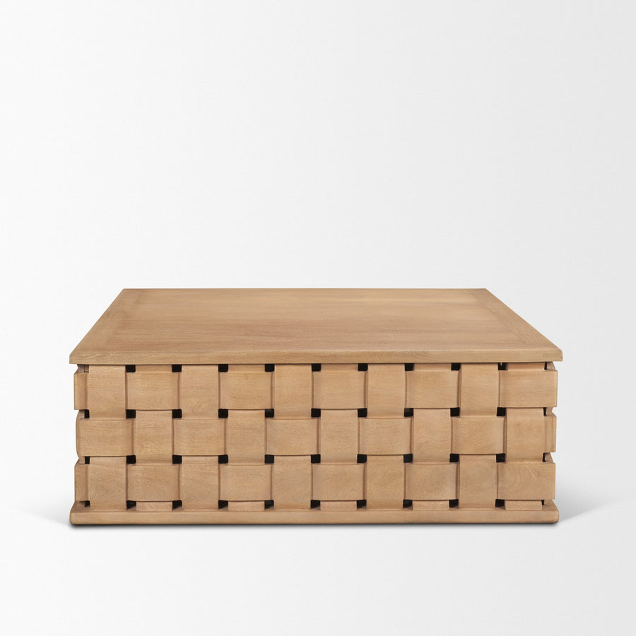 Front view of the Trellyn square coffee table featuring a light natural wood finish and a unique hand-carved woven pattern base