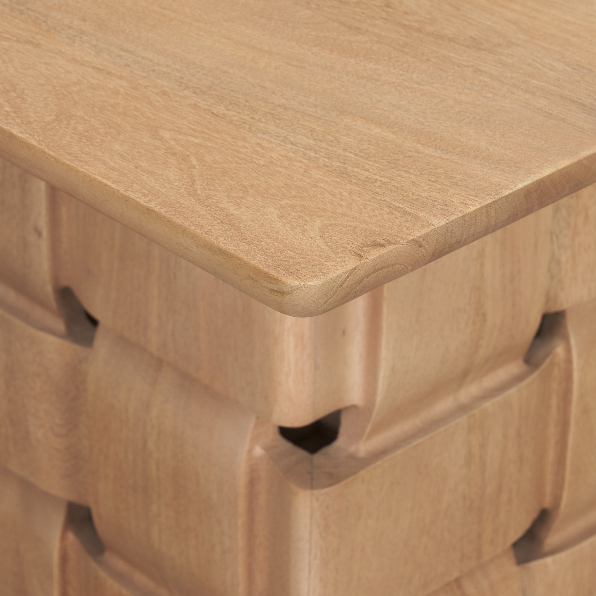 Front view of the Trellyn accent table featuring a smooth square tabletop and a unique architectural base with a hand-carved woven texture in a warm wood finish