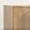 Close up of the carved arch pattern and corner joinery on the natural cabinet