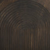 Detailed view of the carved arch texture on the dark wood cabinet doors