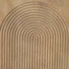 Macro shot of the rhythmic carved arch pattern on the cabinet face