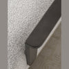 Close-up of dark wood armrest detail on Tyra accent chair