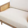 Close-up focusing on the natural wood grain of the oak frame and the plush ivory seat cushion.