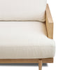 Detailed view of the seat cushion meeting the solid oak frame and cane inlay of the Unio chair.