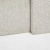 Detailed view of the lower bed frame highlighting the durable bouclé upholstery and uniform seam construction