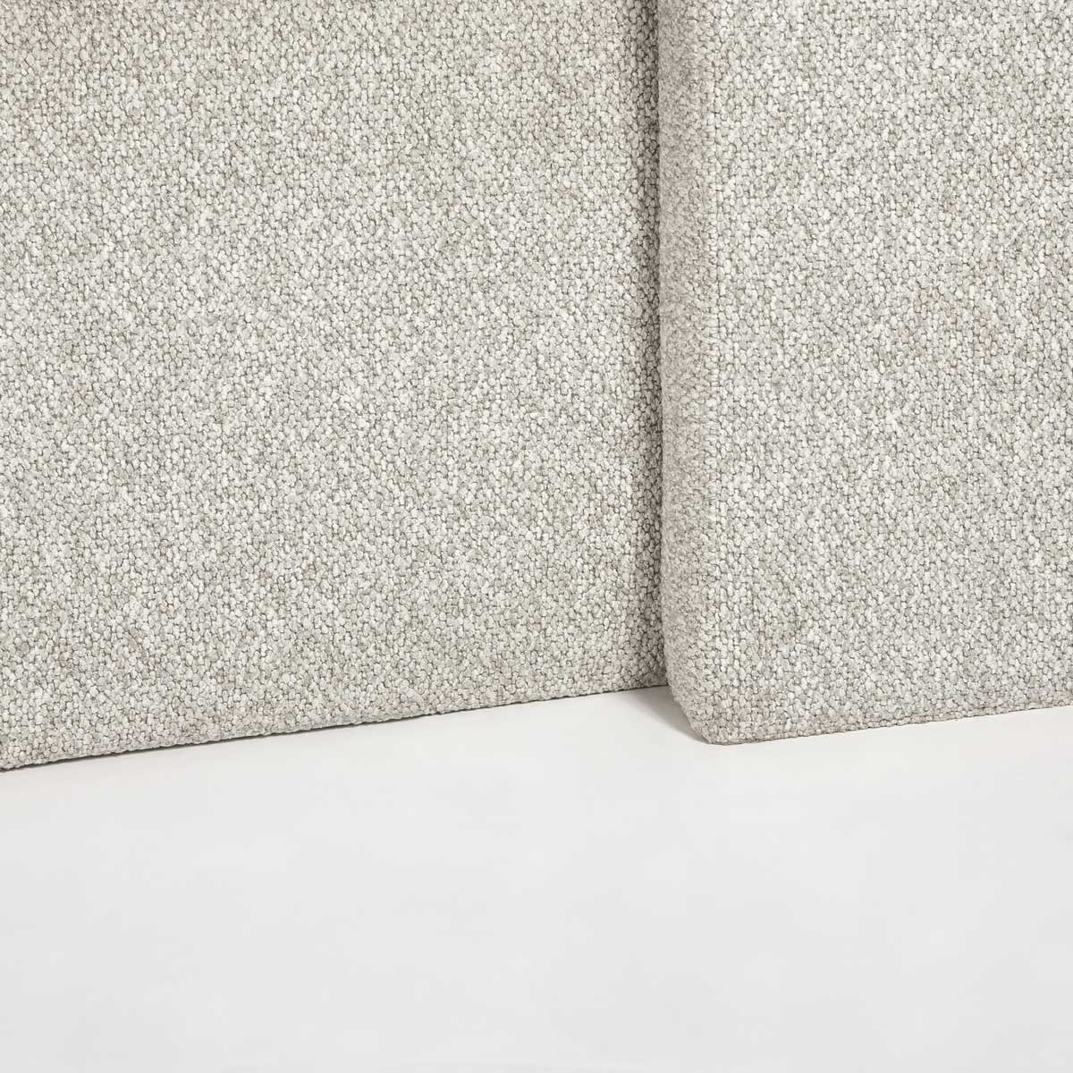 Detailed view of the lower bed frame highlighting the durable bouclé upholstery and uniform seam construction