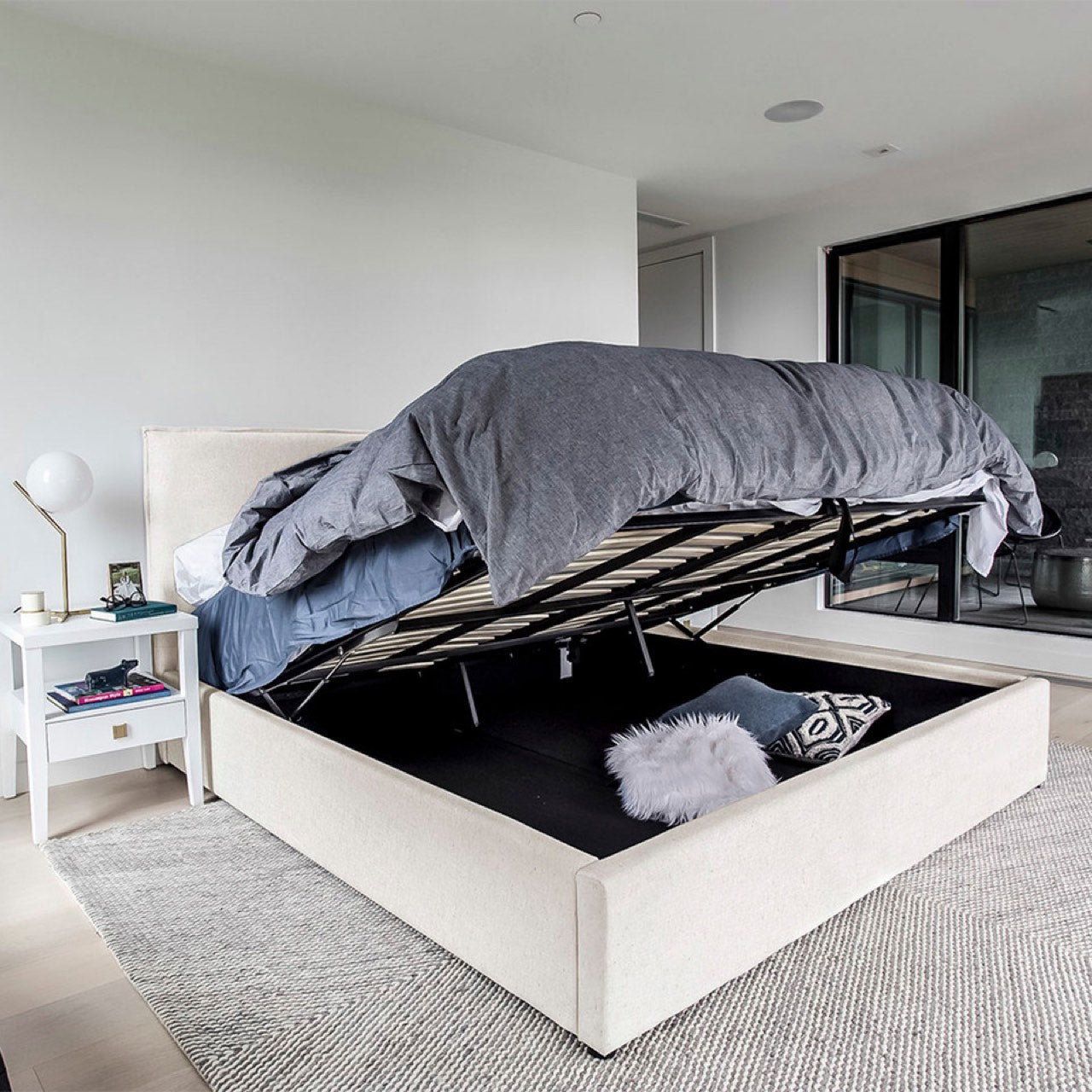 Front view highlighting the soft textured upholstery and the clean architectural lines of the bed frame