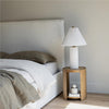 Side view of the bed base rail highlighting the seamless upholstery and the high-quality fabric finish