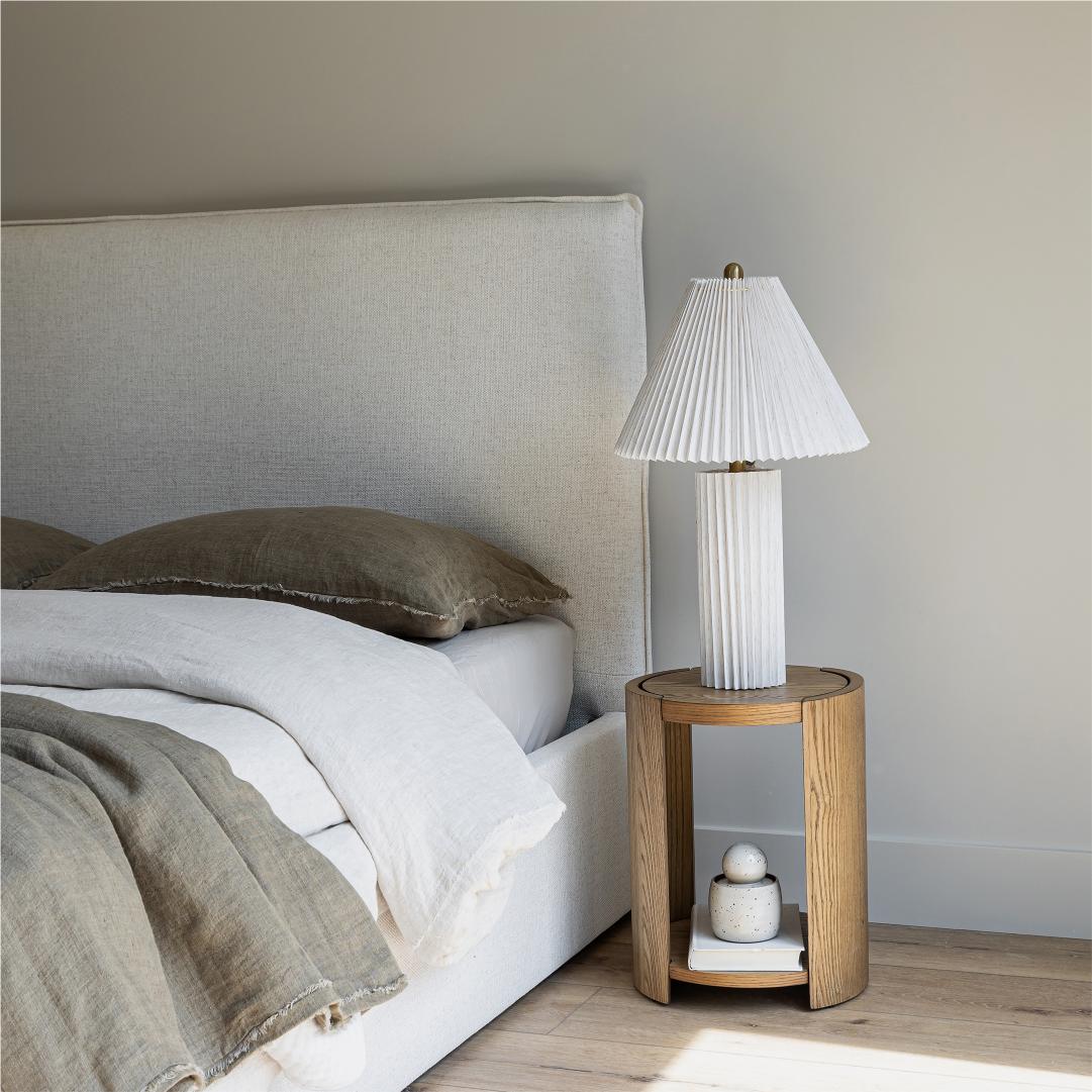 Front view highlighting the soft textured upholstery and the clean architectural lines of the bed frame