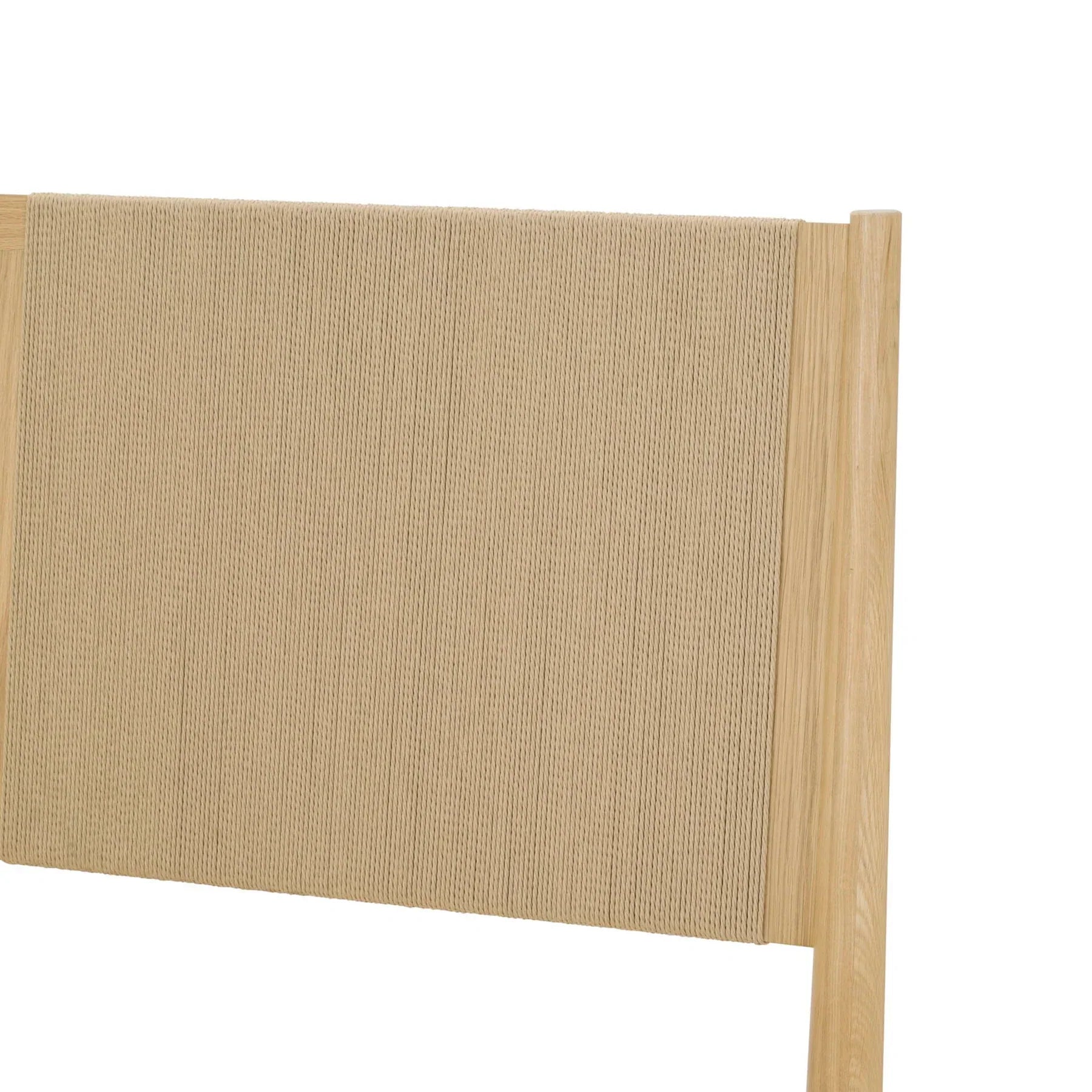Close-up shot focusing on the textured gray fabric headboard and the glowing ambient LED light strip