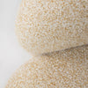 Macro shot highlighting the multi-tonal cream and beige fibers of the Estelle chair's textured upholstery.