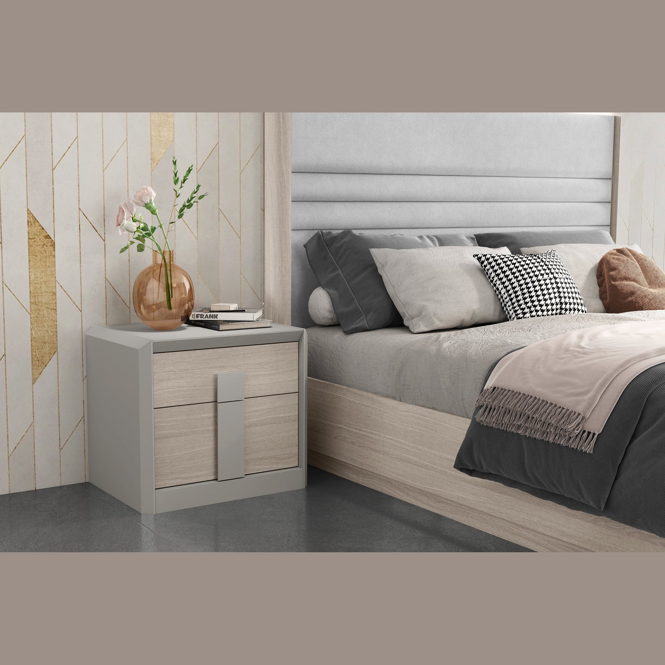 Lifestyle shot featuring the Velar nightstand with a matte gray frame and sand oak drawer fronts styled next to a coordinating horizontal channel-tufted bed