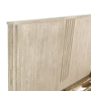 Close-up shot of the headboard corner focusing on the precision vertical carved line accents and natural wood grain