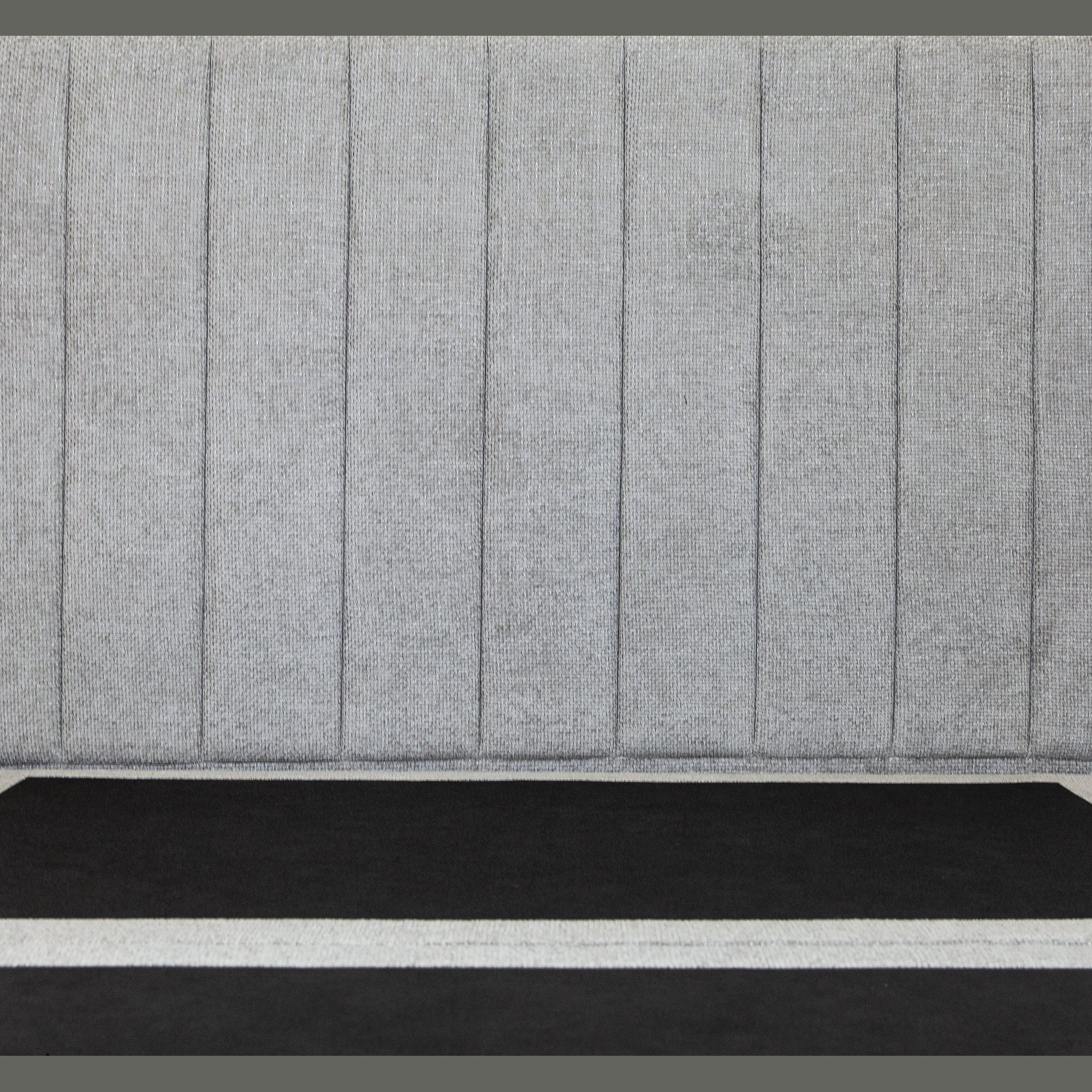 Front view of the Norell storage bed featuring a neutral woven fabric finish and a vertical channel tufted headboard