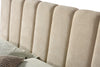 Close-up shot focusing on the high-quality cream fabric texture and the precision of the vertical channel stitching