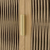 Macro shot focusing on the slim vertical gold handle against the textured fluted glass and light wood door