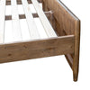 Close-up shot focusing on the tactile vertical wood slats and natural grain variations of the footboard