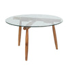 Three-quarter perspective highlighting the airy design and the sculptural wood frame of the Vineyard round patio table