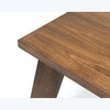 Detailed shot of the substantial tapered block leg showcasing unique wood grain patterns and a polished finish