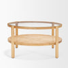 Front view of the Weslyn coffee table featuring a circular glass top and a natural woven cane lower storage shelf