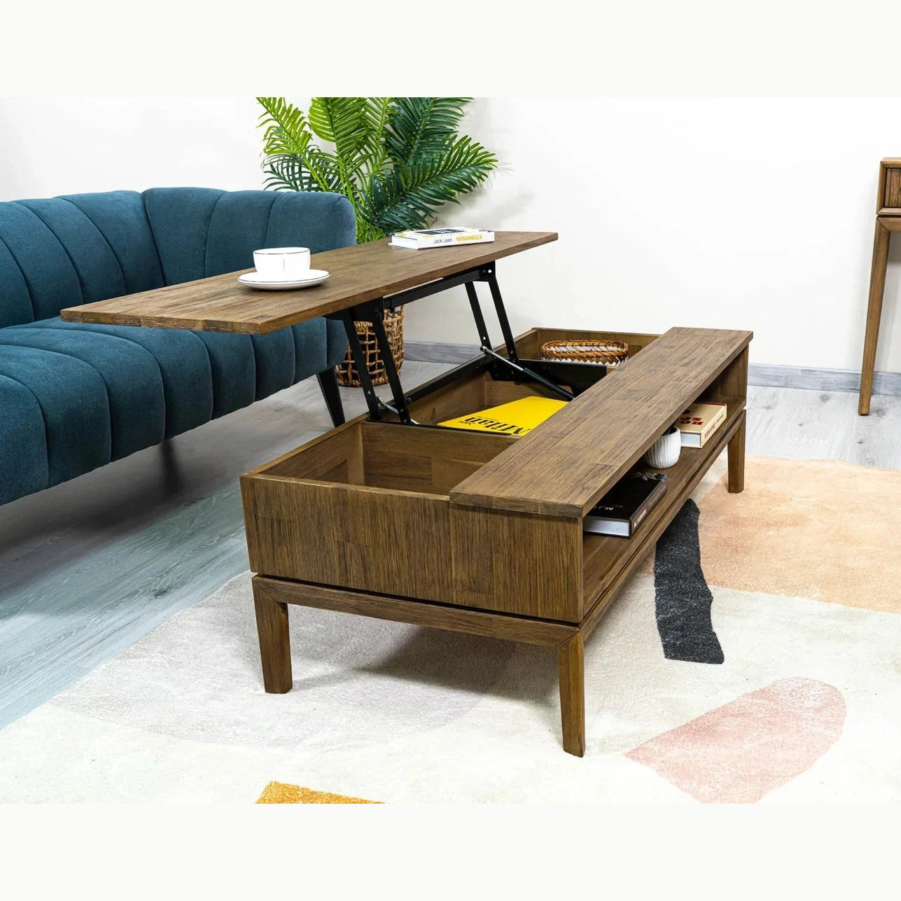 Front view of the West coffee table with the lift-top mechanism extended to reveal internal storage compartments