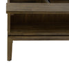 Close-up shot highlighting the solid wood tapered legs and the lower shelf joinery of the West table