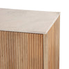 Close-up shot focusing on the transition between the polished marble stone and the textured fluted wood frame