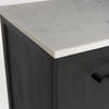 Close-up shot of the corner joinery where the polished white marble top meets the dark charcoal wood frame