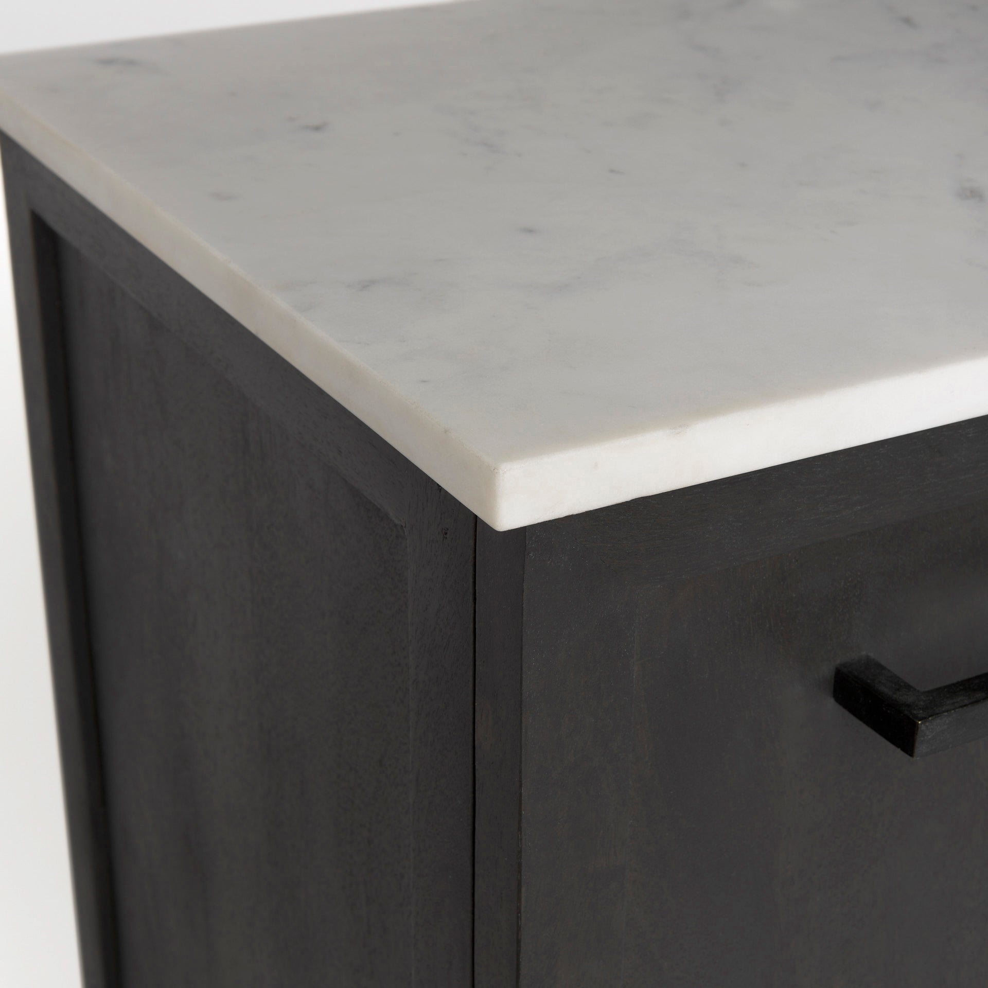 Front perspective view of the Gemma sideboard featuring a dark charcoal wood finish, a white marble top, and slim black metal legs