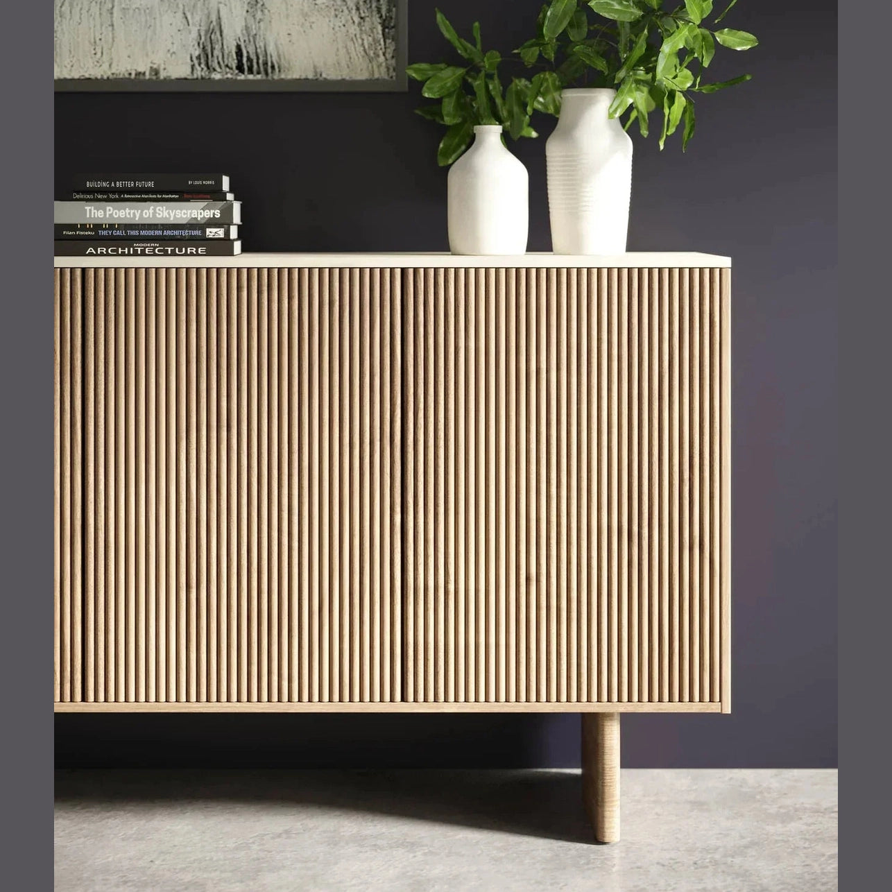 Front perspective view of the Hedron sideboard featuring vertical fluted oak wood panels and a white marble top surface