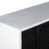 High-angle close-up highlighting the clean matte white finish and precise corner joinery of the sideboard's top surface
