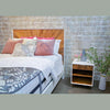 Alternate lifestyle angle showcasing the bed in a bright room with minimalist decor and natural lighting