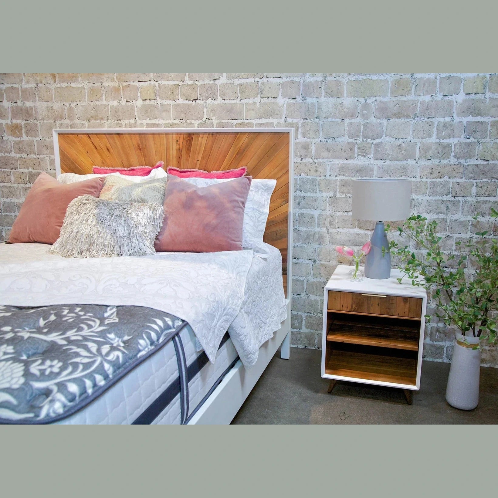 Front view of the Casablanca platform bed featuring a striking natural wood sunburst inlay on the headboard and footboard