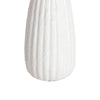 Close-up macro shot focusing on the tactile vertical fluting and organic matte white texture of the table base