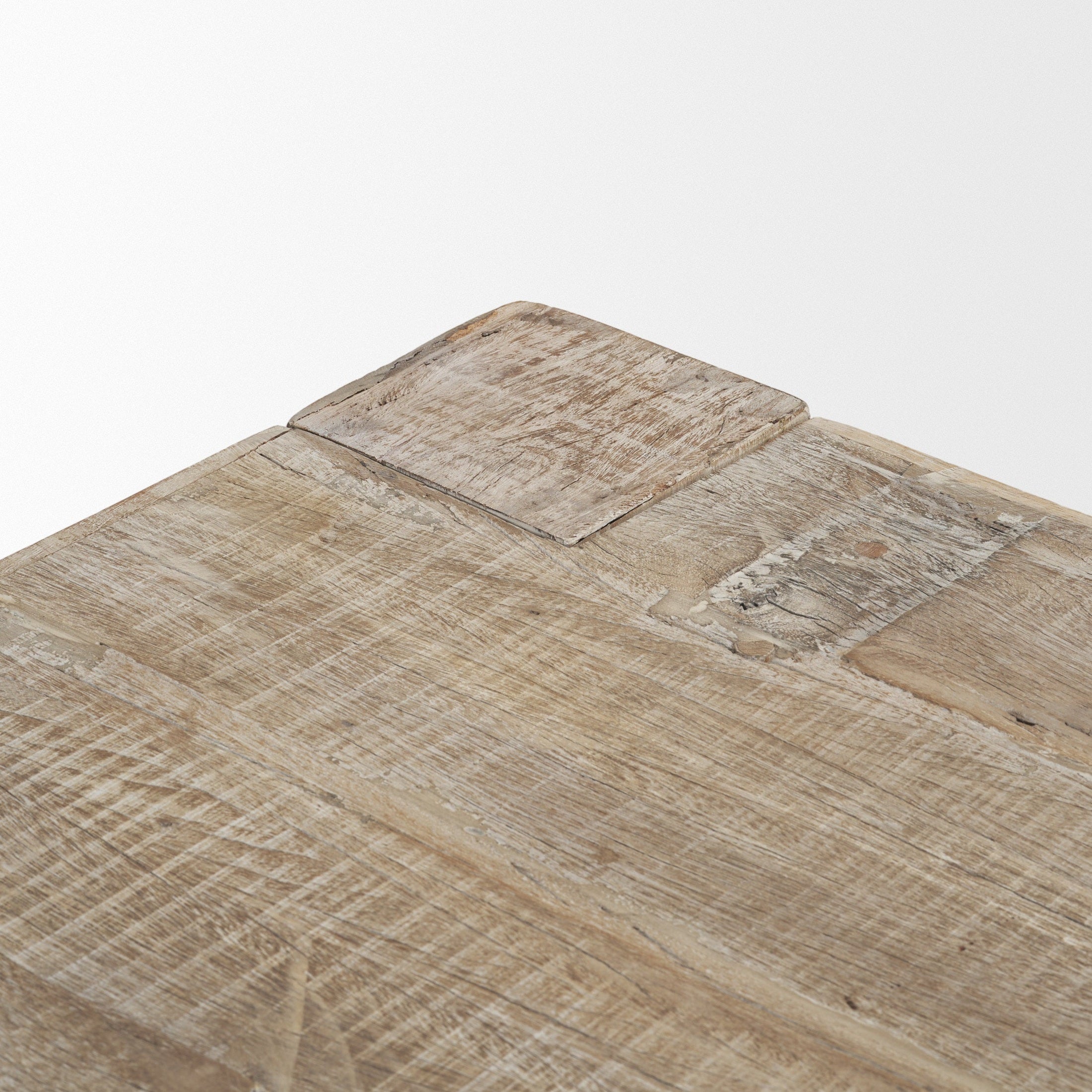 Front view of the 94-inch McArthur dining table featuring a whitewash finish and a substantial Parsons-style reclaimed wood construction