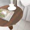 High-angle perspective view showcasing the circular symmetry and the organic aesthetic of the tripod accent table