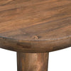Close-up shot focusing on the smooth surface and rich natural grain patterns of the solid wood tabletop