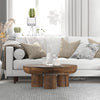 Perspective lifestyle shot showcasing the table's scale next to a contemporary upholstered sofa
